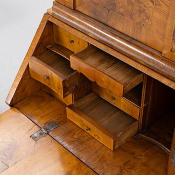 A Swedish rococo burr-alder veneered cabinet, later part 18th century.
