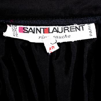 YVES SAINT LAURENT, a black silk skirt.