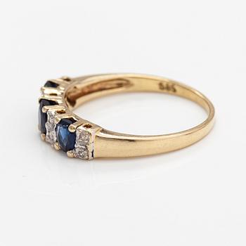 A 14K gold ring with diamonds ca. 0.05 ct and sapphires. Finnish import marks 1990.