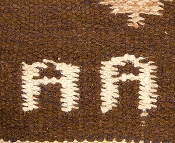 A signed Swedish flatweave carpet ca 207 x 137 cm.