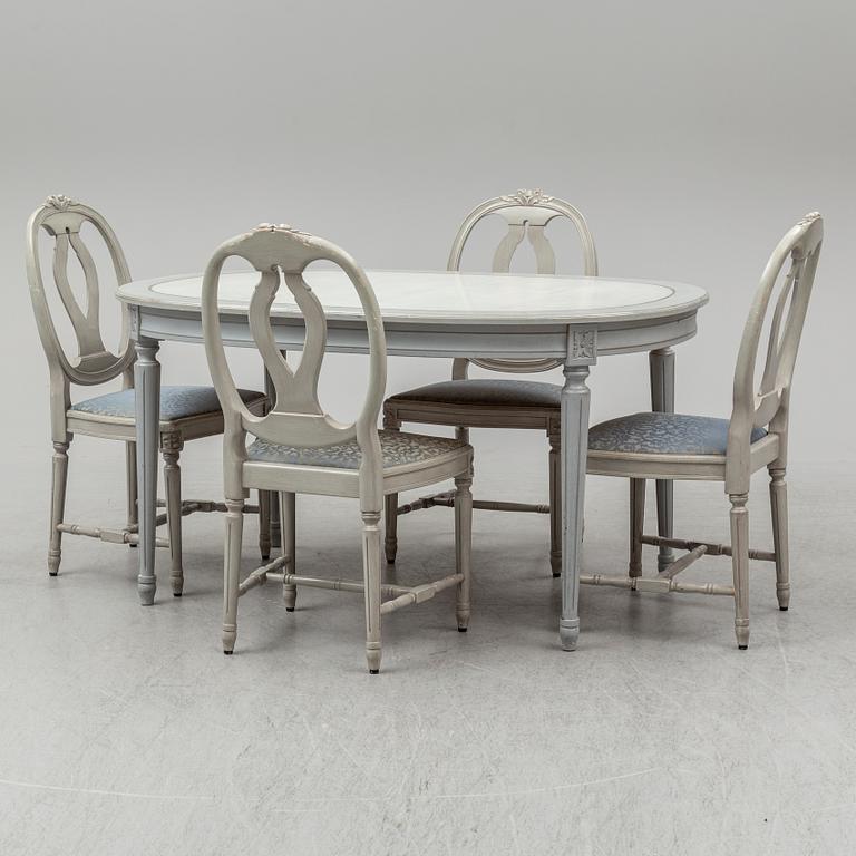 A dining table and four chairs, gustavian style, late 20th century.