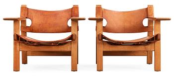 A pair of Børge Mogensen oak and leather 'Spanish Chair' by Fredericia Stolefabrik, Denmark.