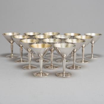 A SET OF 14 SILVER COCKTAILGLASSES, 1960s.