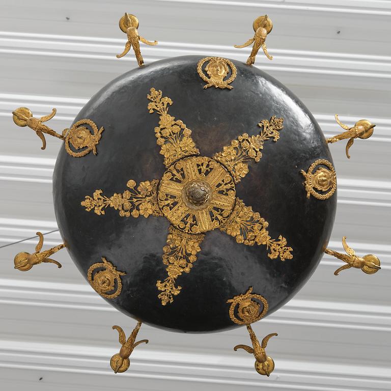 A presumably Russian Empire gilt and patinated bronze nine-branch chandelier, 19th century.