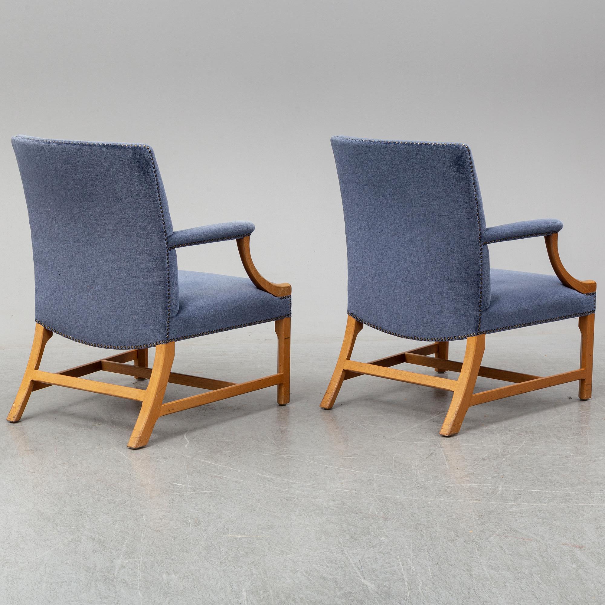 A mid 20th Century pair of oak armchairs attributed to Carl Malmsten.