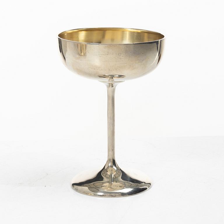 Champagne goblets, 8 similar, silver, including CG Hallberg, Stockholm, 1930.