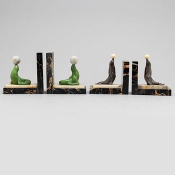 Two pairs of 20th century Art Deco bookstands decorated with sealions.