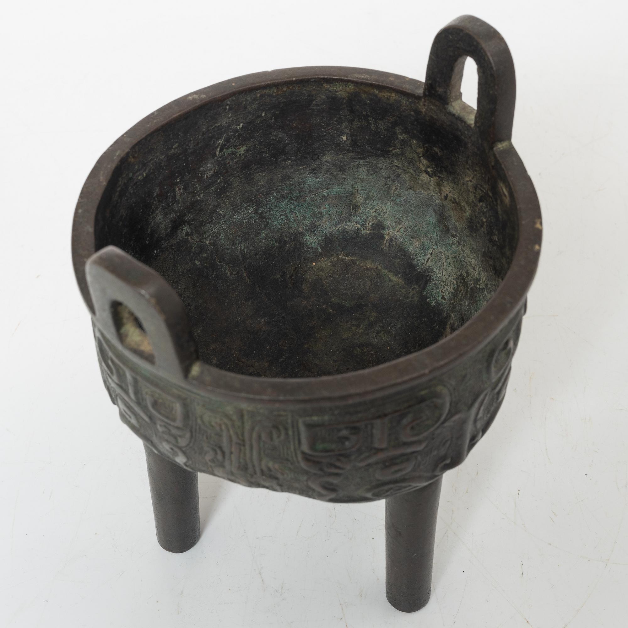 A Chinese tripod bronze censer, Ming style, Qing dynasty (1644-1912).