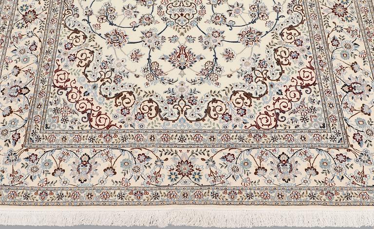 A Nain part silk carpet, 244 x 156 cm.