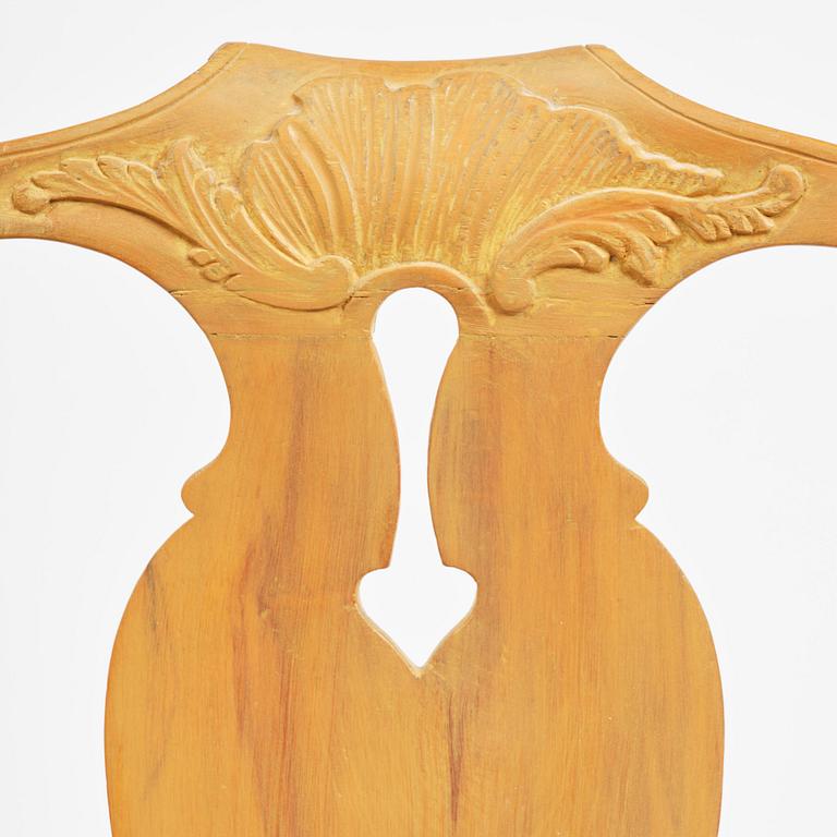 A pair of rococo open-back armchairs, Stockholm, later part 18th century.