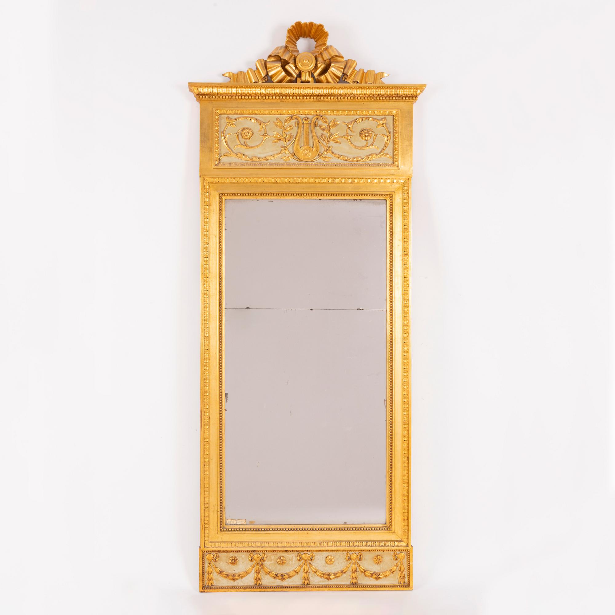 A late-Gustavian giltwood mirror, Stockholm, late 18th century.