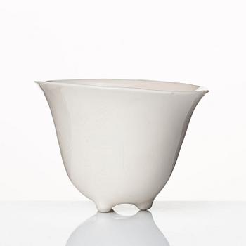 A rhinoserous shaped blanc de chine libation cup, Qing dynasty.