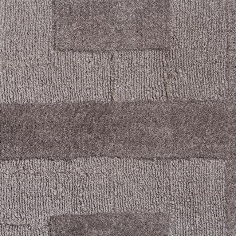 A Layered "Wool Cubes" carpet, 390x620 cm.