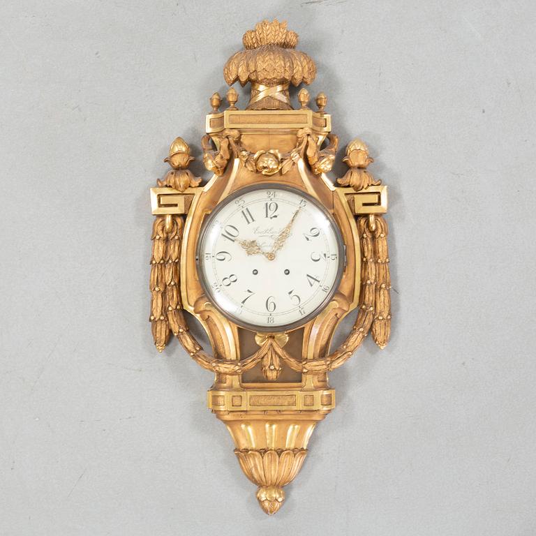 A wall clock marked Evert Lundberg Linköping from the first half of the 20th century.