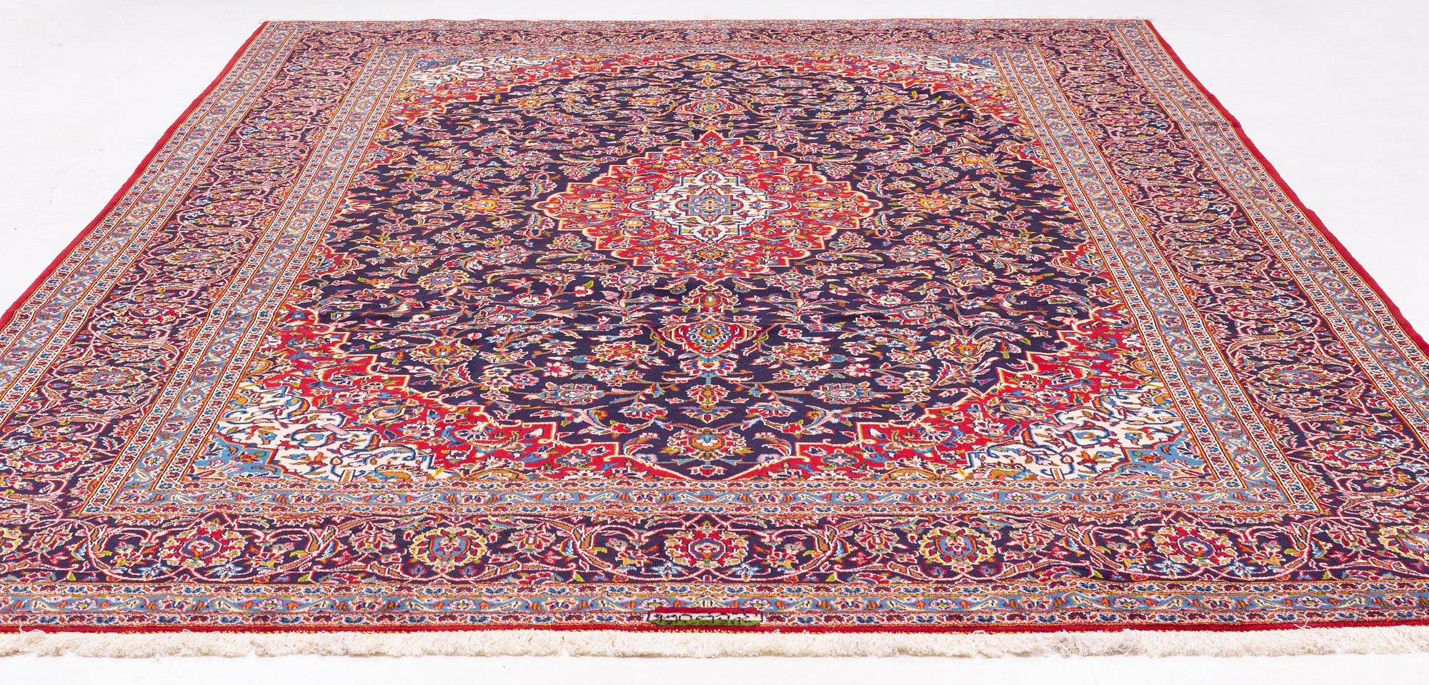 A Kashan carpet signed, approx. 420 x 292 cm.