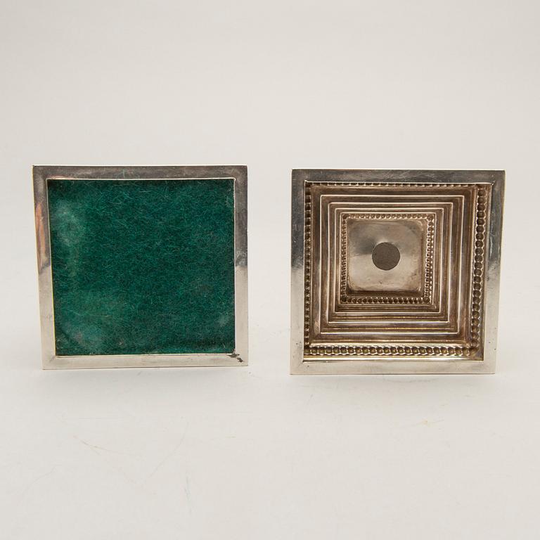 A pair of classical column sterling silver candlesticks Birmingham, 1934, by 'B.G. & Co'.