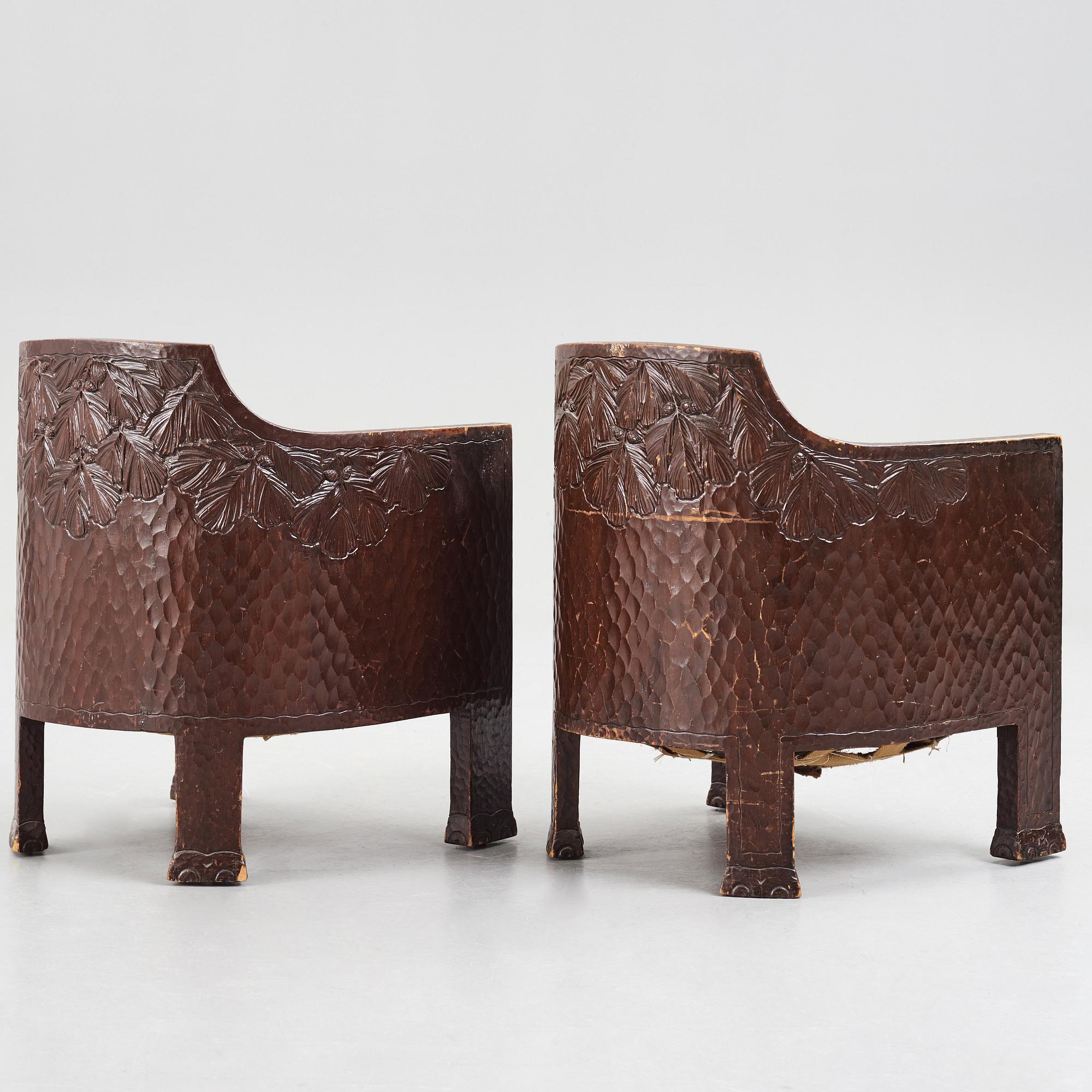Otto Wretling, attributed to, a pair of Art Nouveau carved pine easy chairs,