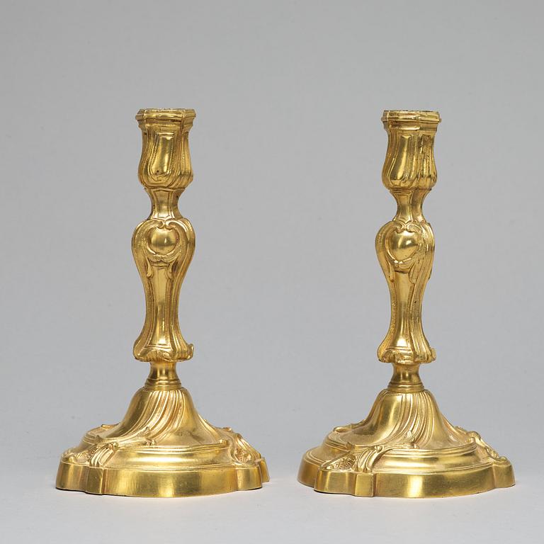 A pair of Louis XV-style candlesticks, circa 1900.