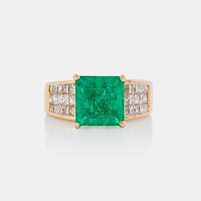 An emerald, circa 3.5 cts, and diamond, circa 1.95 cts, ring.