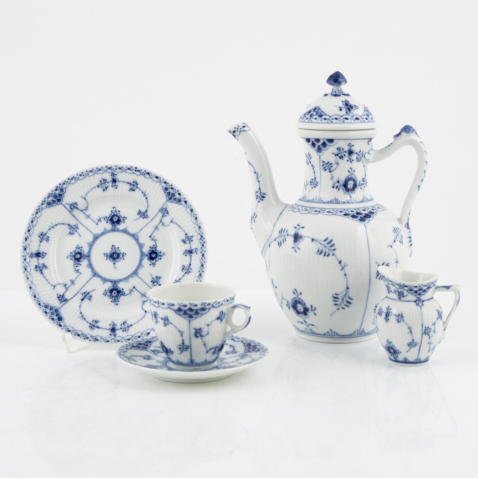 A 26-piece porcelain coffee sevice, half lace 'Musselmalet', Royal Copenhagen, Denmark.