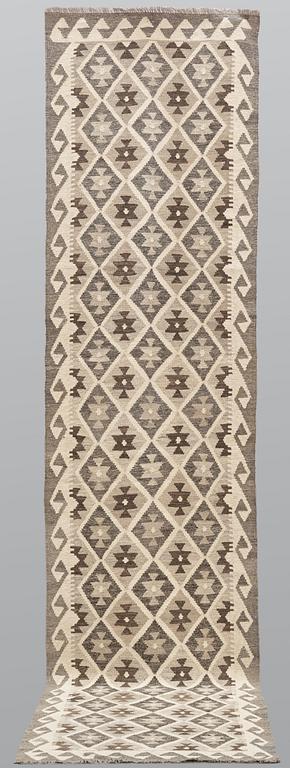 A Kilim runner carpet, c. 391 x 85 cm.