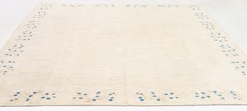 An Antique Peking rug, northern China, c 344 x 240 cm.