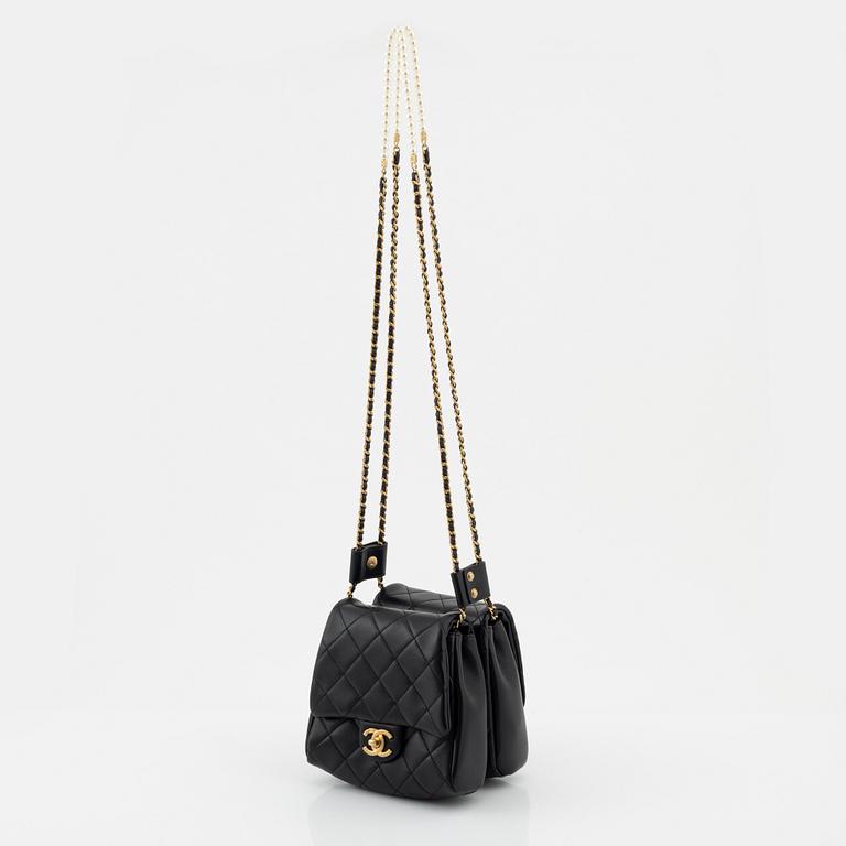 Chanel, a black leather, gold hardware and pearl chain 'Side Pack bag', 2019.