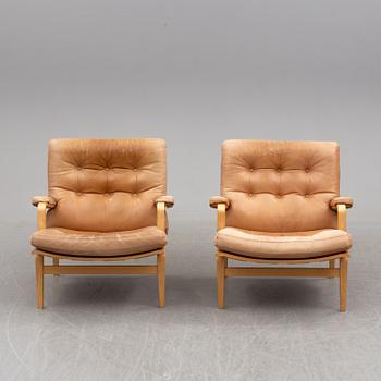 BRUNO MATHSSON, a pair of easy chairs with one stool.