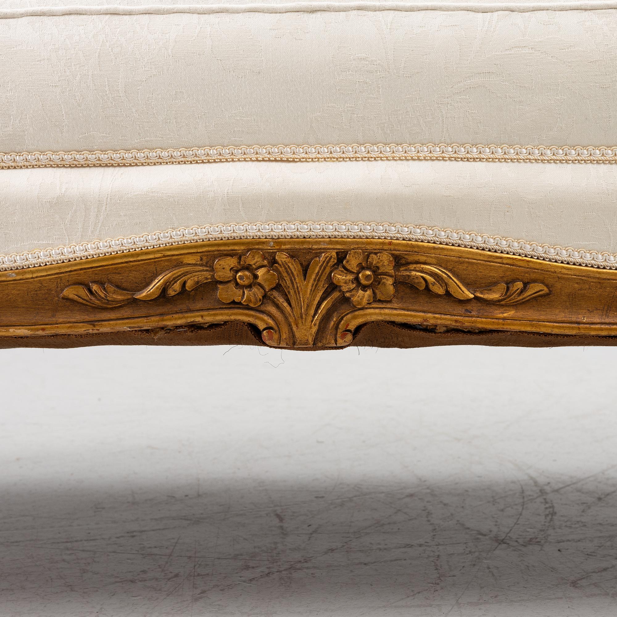 A Louis XV-style sofa, early 20th century.