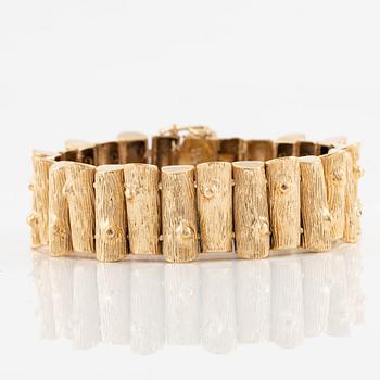 Armband, 18K guld,  med motiv i form av vedträ.
