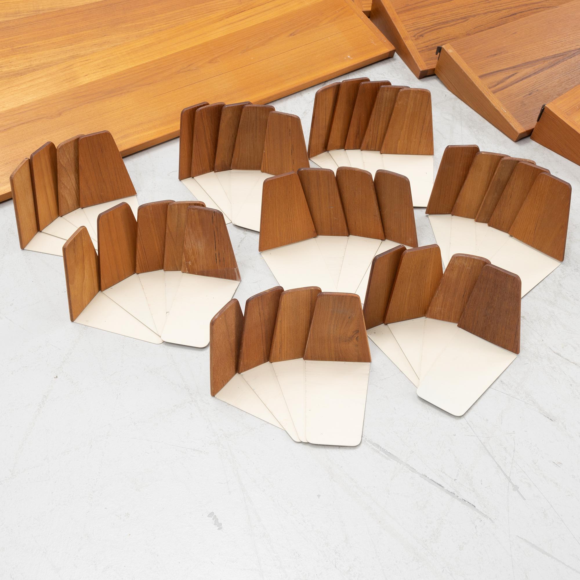 A teak and teak veneered shelf system, mid 20th century.