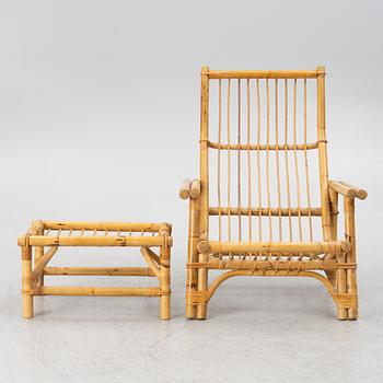 An easy chair with foot stool, end of the 20th century.