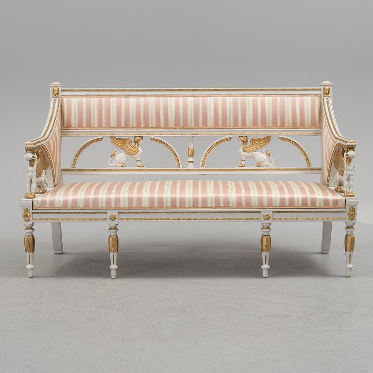 A set of two armchairs, a sofa, a stool and a chair. Early 20th century.