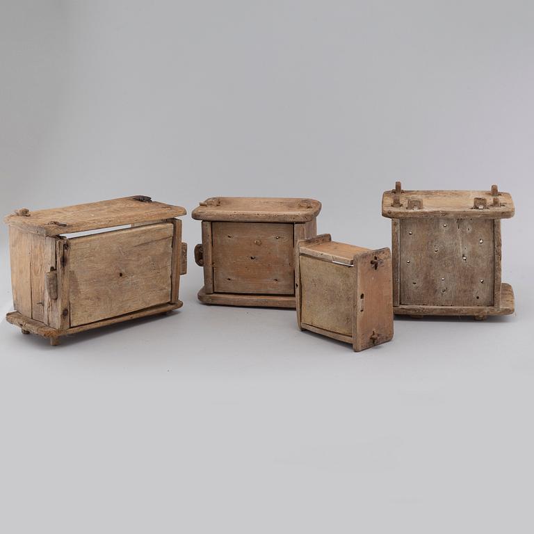 Four handcrafted wooden tins, 19th century.