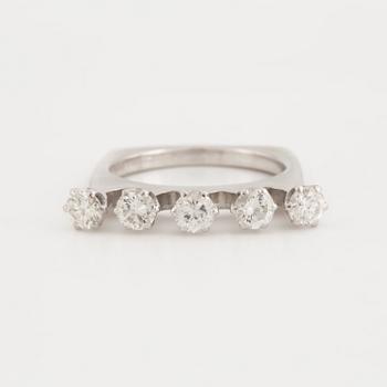 A ring set with five, round, brilliant-cut diamonds.