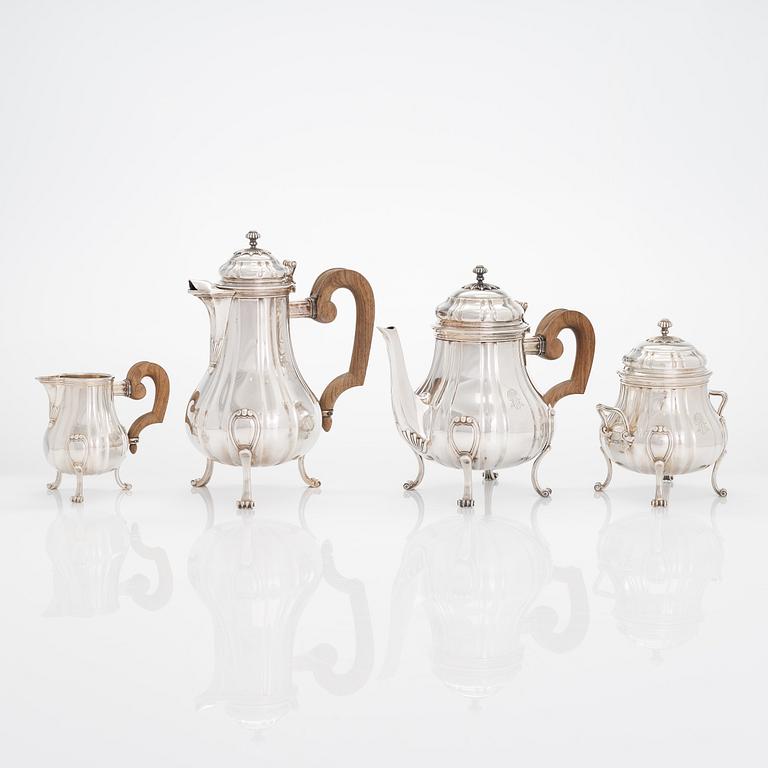 A French four-piece silver coffee and tea set, mark of Emile Puiforcat, Paris, first quarter of the 20th century.