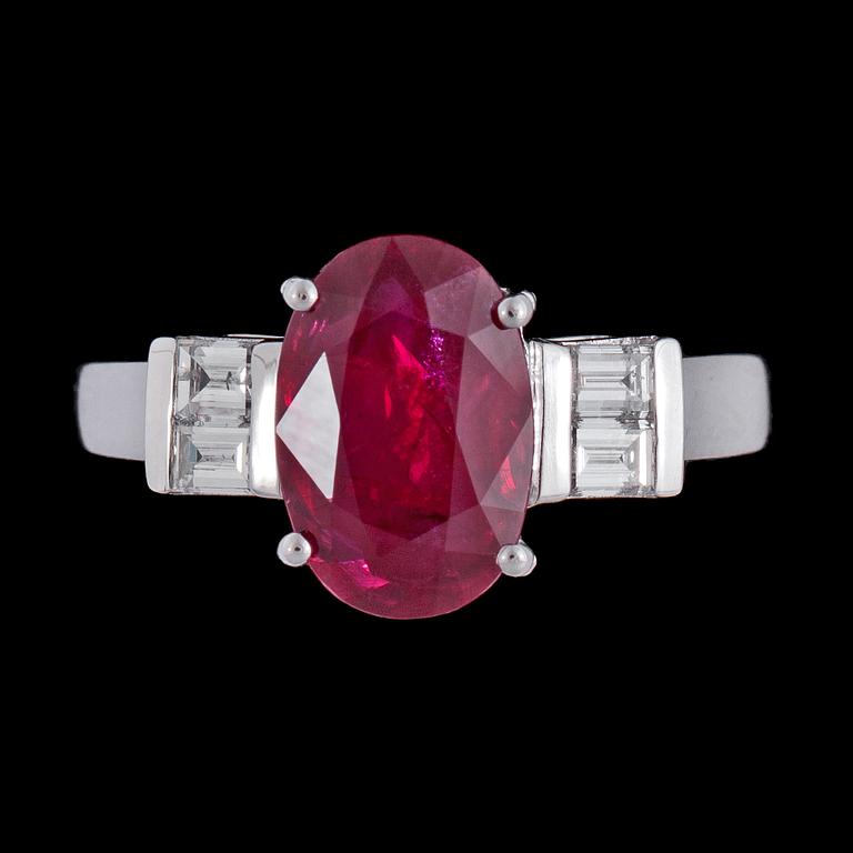 A ruby, 3.02 cts, and emerald cut diamond ring.