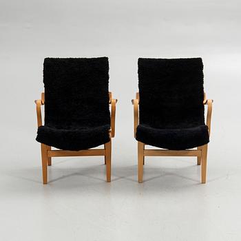 Bruno Mathsson, armchairs, a pair, "Eva", Bruno Mathsson International, Värnamo, second half of the 20th century.