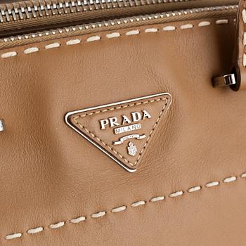 Prada, a leather handbag.