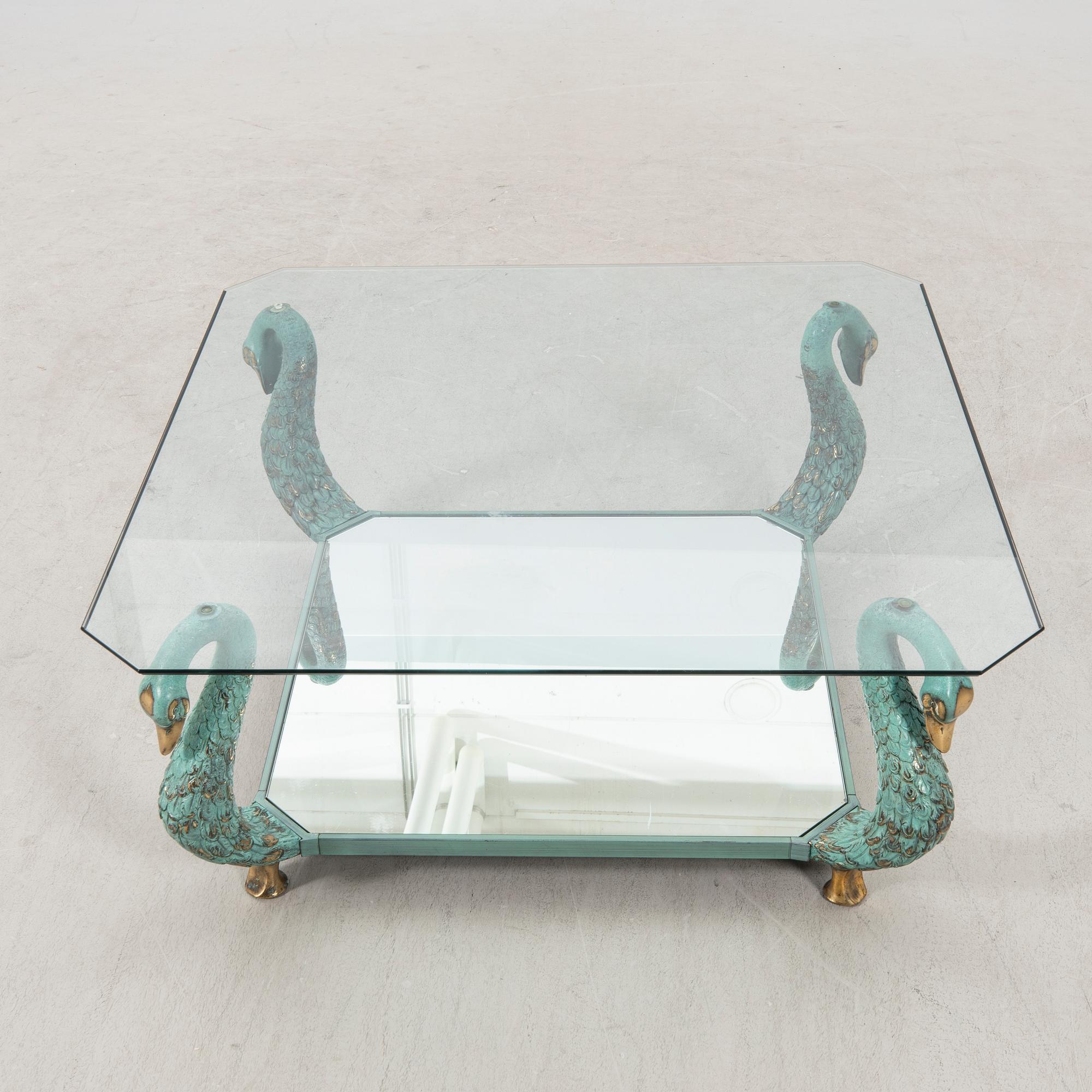 A late 20th century glass and metal coffee table.