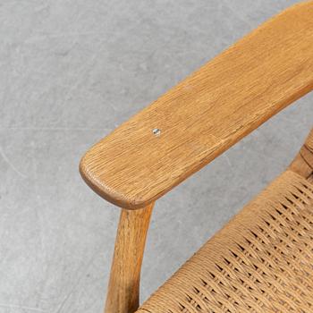 A 'CH-25' armchair designed by Hans J Wegner for Carl Hansen & Søn, Denmark.