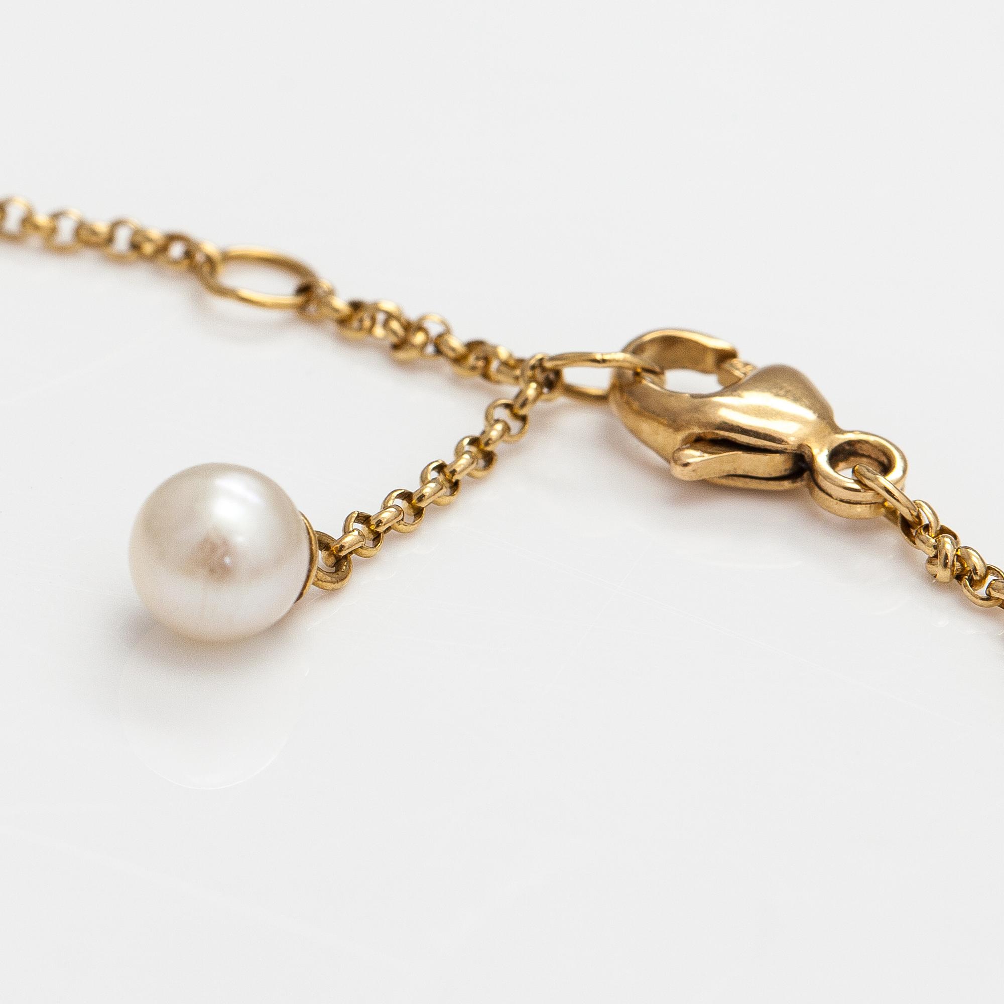 Georg Jensen, An 18K gold bracelet "Magic" with a cultured pearl and diamonds ca. 0.048 ct in total, Denmark.