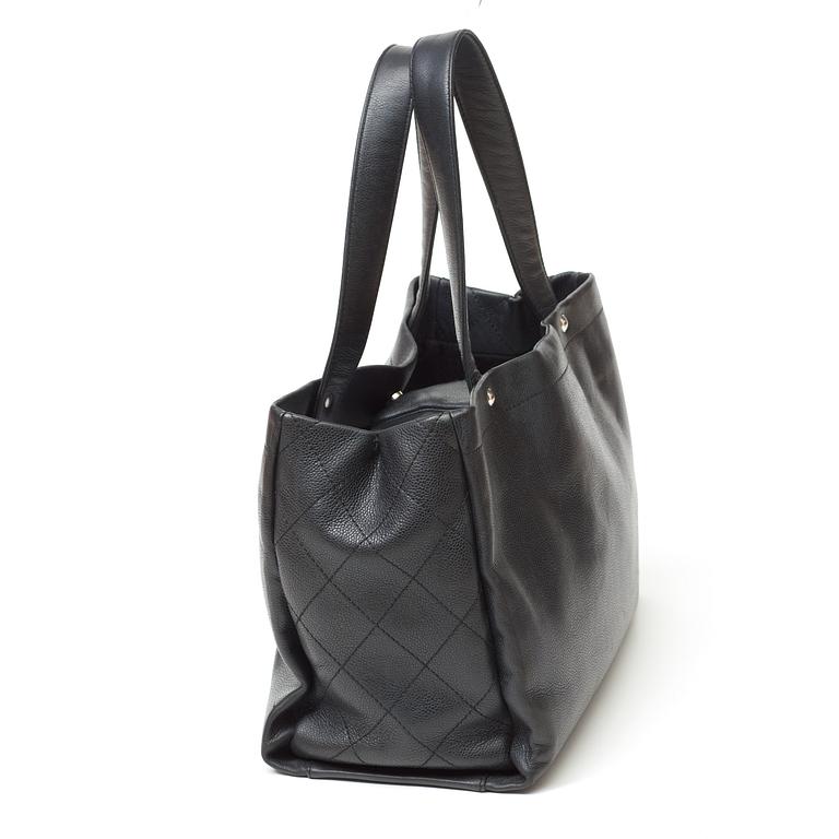 A black leather handbag by Chanel.