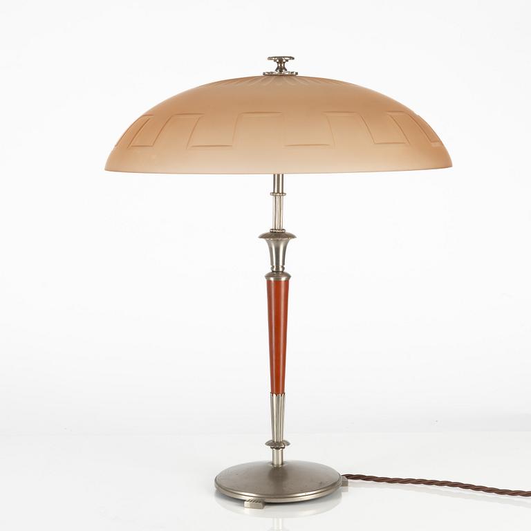 Harald Notini, a table lamp model "6944" with glass shade model "10050", Arvid Böhlmarks Lampfabrik, 1920s-1930s.