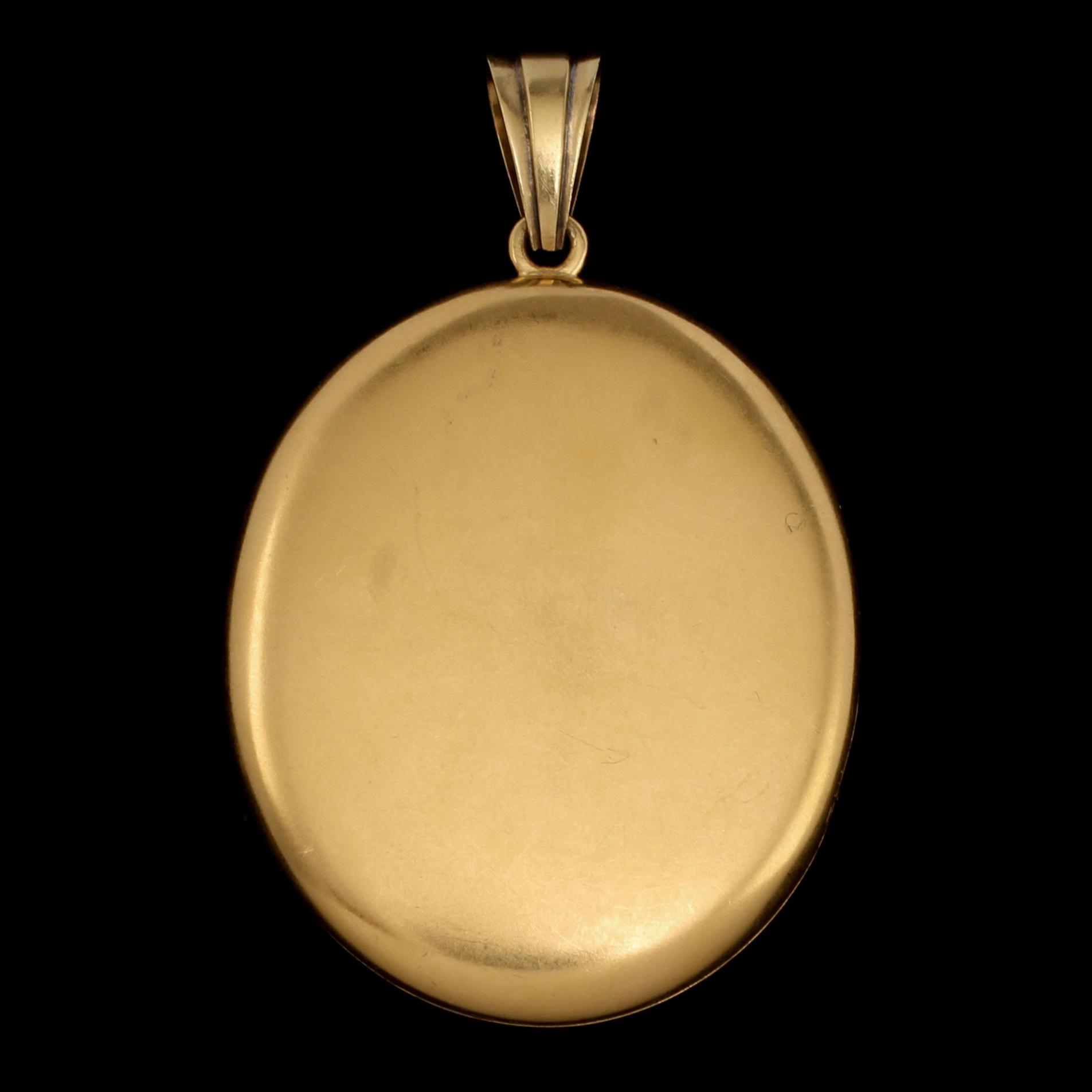 BERLOCK, 14k guld med fasettslipad diamant och onyx, trol Ryssland, 1900-tal. Vikt 27 g.
