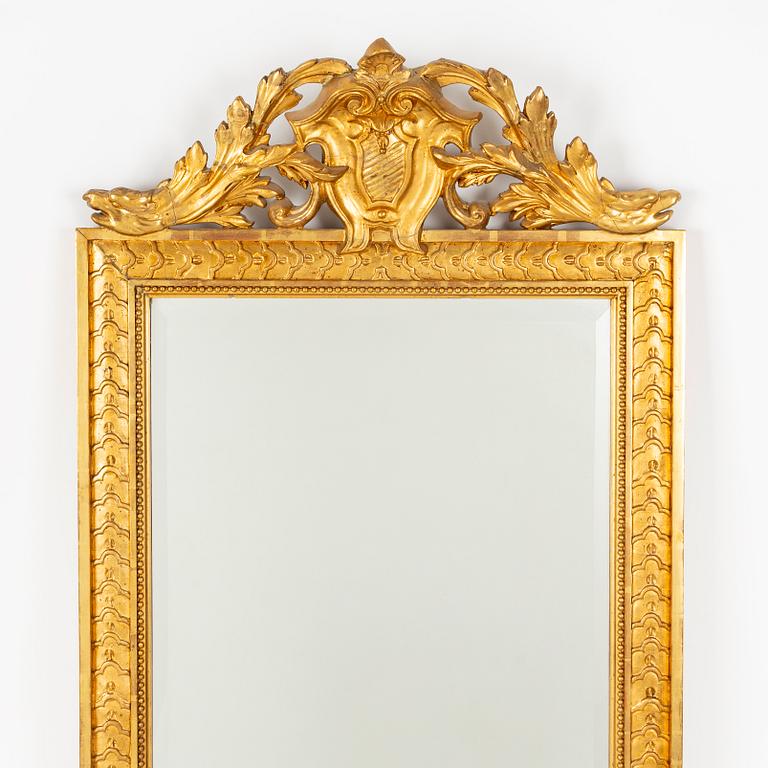 A Gustavian Style Mirror with Table, circa 1900.