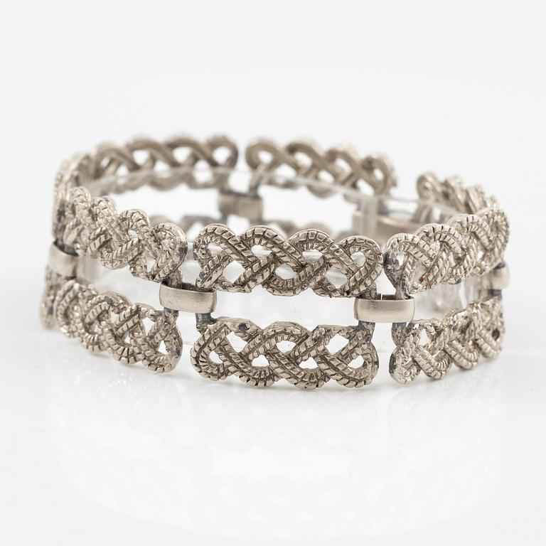 Armband vit metall.