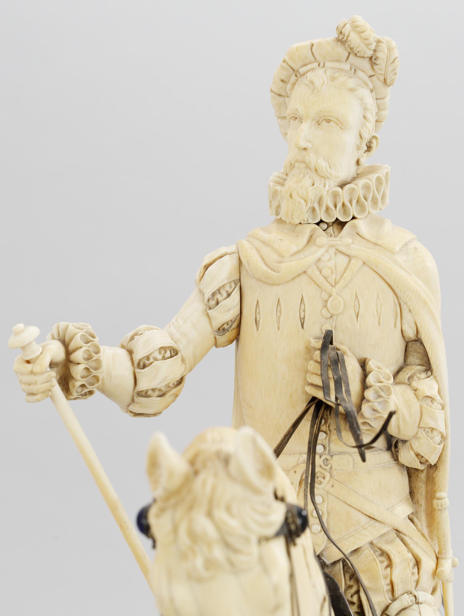 A late 19th century equestrian ivory, wood and metal statue.