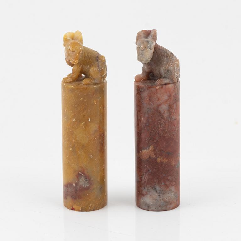 A set of four stone scholars objects and a enameled silver box with cover, Qing dynasty, circa 1900.