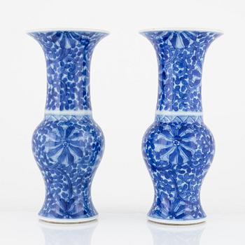A pair of blue and white trumpet shaped vases, Qing dynasty, circa 1900.